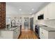 Updated kitchen with granite counters and stainless appliances at 702 W Kentucky Ave, Tampa, FL 33603