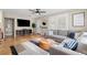 Bright living room featuring hardwood floors, neutral tones, and an inviting sectional sofa at 702 W Kentucky Ave, Tampa, FL 33603