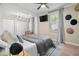 Spacious main bedroom featuring recessed lights, neutral walls, modern decor, and integrated closet space at 702 W Kentucky Ave, Tampa, FL 33603