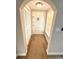 Inviting entryway with wood-look flooring, closet, and well-lit space at 7314 Ivanhoe Dr, Port Richey, FL 34668