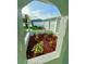 Inviting view of front landscaping with colorful mulch and well-kept plants at 7314 Ivanhoe Dr, Port Richey, FL 34668