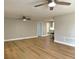 Spacious living room with an open layout and clear sightlines to the kitchen at 7314 Ivanhoe Dr, Port Richey, FL 34668