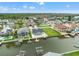Aerial view of a waterfront community with private docks, beautiful landscaping and canal access at 7401 Islander Ln, Hudson, FL 34667