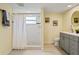 Well-lit bathroom with a glass shower and coordinated fixtures at 7401 Islander Ln, Hudson, FL 34667