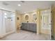 Modern bathroom with double vanity, tiled floor, and glass-enclosed shower at 7401 Islander Ln, Hudson, FL 34667