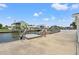 Waterfront property with a private dock and boat lift and serene water views at 7401 Islander Ln, Hudson, FL 34667