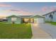 Charming single-story home with a well-maintained lawn and inviting curb appeal at 7401 Islander Ln, Hudson, FL 34667