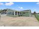 The home's exterior features a large patio, fenced in yard and mature landscaping at 7401 Islander Ln, Hudson, FL 34667