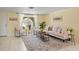 Bright living room with neutral tones, stylish decor, and ample natural light at 7401 Islander Ln, Hudson, FL 34667