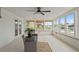 Bright sunroom with multiple windows and comfortable seating at 7401 Islander Ln, Hudson, FL 34667