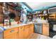 Eat-in kitchen with stainless appliances and unique accents, cabinetry and countertop at 7441 Cypress Dr, New Port Richey, FL 34653