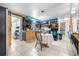 Bright eat-in kitchen with wooden cabinets and a view to the bedroom and living areas at 7441 Cypress Dr, New Port Richey, FL 34653