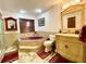 A well-appointed bathroom with a corner tub, and classic-style vanity and fixtures at 8834 Whispering Oaks Trl, New Port Richey, FL 34654