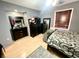 Nicely decorated bedroom with dresser, rug, and neutral color walls at 8834 Whispering Oaks Trl, New Port Richey, FL 34654
