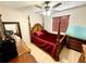 Bedroom featuring a four poster bed, hardwood floors and wood furniture at 8834 Whispering Oaks Trl, New Port Richey, FL 34654