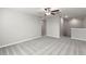 Versatile bonus room with carpet flooring and recessed lighting is perfect for a play or media room at 8918 Parsons Hill Blvd, Wesley Chapel, FL 33545