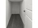 Walk-in closet provides ample storage space with neutral carpet and base trim at 8918 Parsons Hill Blvd, Wesley Chapel, FL 33545
