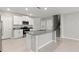 The kitchen has stainless appliances, granite countertops, and white cabinets at 8918 Parsons Hill Blvd, Wesley Chapel, FL 33545
