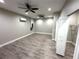 Large flex room with laminate wood flooring and bright lighting at 9005 W Flora St, Tampa, FL 33615