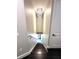 Elegant staircase featuring a modern chandelier and dark wood steps at 9005 W Flora St, Tampa, FL 33615