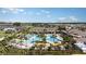 Aerial view showcasing the community pool and the surrounding neighborhood at 10282 Echo Dock Loop, San Antonio, FL 33576