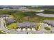 Overhead view of townhomes, featuring scenic water and green belt views in the community at 10282 Echo Dock Loop, San Antonio, FL 33576