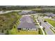 Scenic aerial of a home overlooking a pond and surrounding green spaces within the neighborhood at 10282 Echo Dock Loop, San Antonio, FL 33576