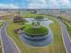 An aerial view of a beautifully landscaped community with ponds and roads at 10282 Echo Dock Loop, San Antonio, FL 33576