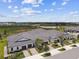 Wide aerial perspective showcasing modern homes, manicured landscaping, and waterfront scenery at 10282 Echo Dock Loop, San Antonio, FL 33576