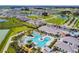 Aerial view showcasing the resort style community pool and surrounding neighborhood at 10282 Echo Dock Loop, San Antonio, FL 33576