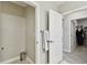 The bright powder room includes storage, towel rack, and easy access from the hall at 10282 Echo Dock Loop, San Antonio, FL 33576