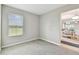 This bedroom features a large window offering plenty of natural light at 10282 Echo Dock Loop, San Antonio, FL 33576