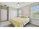 Bedroom with a ceiling fan, carpeted floors, and good natural light at 10282 Echo Dock Loop, San Antonio, FL 33576