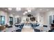 Clubhouse with tables, chairs, bar, and chandeliers at 10282 Echo Dock Loop, San Antonio, FL 33576