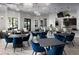 Clubhouse with tables, chairs, and modern chandeliers at 10282 Echo Dock Loop, San Antonio, FL 33576