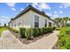 Beautiful single-story home showcasing manicured shrubs, a brick walkway, and a charming facade at 10282 Echo Dock Loop, San Antonio, FL 33576