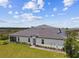 Beautiful single-story home with a well-manicured lawn and a modern tile roof at 10282 Echo Dock Loop, San Antonio, FL 33576