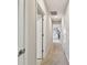 Hallway with neutral colored walls and access to other rooms in the house at 10282 Echo Dock Loop, San Antonio, FL 33576