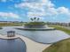 A beautifully landscaped community water feature with a gazebo at 10282 Echo Dock Loop, San Antonio, FL 33576