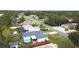 An aerial view of the property shows a well-manicured lawn and above-ground pool at 10287 Fordham St, Spring Hill, FL 34608