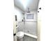 Bathroom features walk-in shower with tiled surround and hexagon floor tiles at 10287 Fordham St, Spring Hill, FL 34608