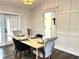 Formal dining room showcasing french doors, hardwood flooring, light fixture and neutral paint at 10287 Fordham St, Spring Hill, FL 34608