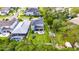 Expansive backyard with a playset, patio seating area, and lush landscaping, perfect for outdoor entertainment at 10399 Boyette Brook St, Riverview, FL 33569