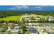 Aerial view of a residential area showcasing well-maintained homes and lush green surroundings at 10399 Boyette Brook St, Riverview, FL 33569