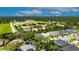 Aerial view of the property in a neighborhood near a church and green spaces, offering convenience at 10399 Boyette Brook St, Riverview, FL 33569