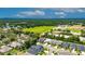 Aerial view showcases a home in a verdant neighborhood, close to green spaces at 10399 Boyette Brook St, Riverview, FL 33569