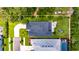 Aerial view of the property highlighting the backyard, driveway, and proximity to neighboring houses at 10399 Boyette Brook St, Riverview, FL 33569