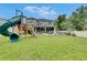 Spacious backyard with a playset and plenty of room for recreation at 10399 Boyette Brook St, Riverview, FL 33569