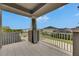 Spacious balcony view overlooking the neighborhood streets from a covered patio with gray tile flooring at 10399 Boyette Brook St, Riverview, FL 33569