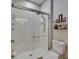 Modern bathroom featuring a glass door shower with white tile, plus shelving for decor at 10399 Boyette Brook St, Riverview, FL 33569